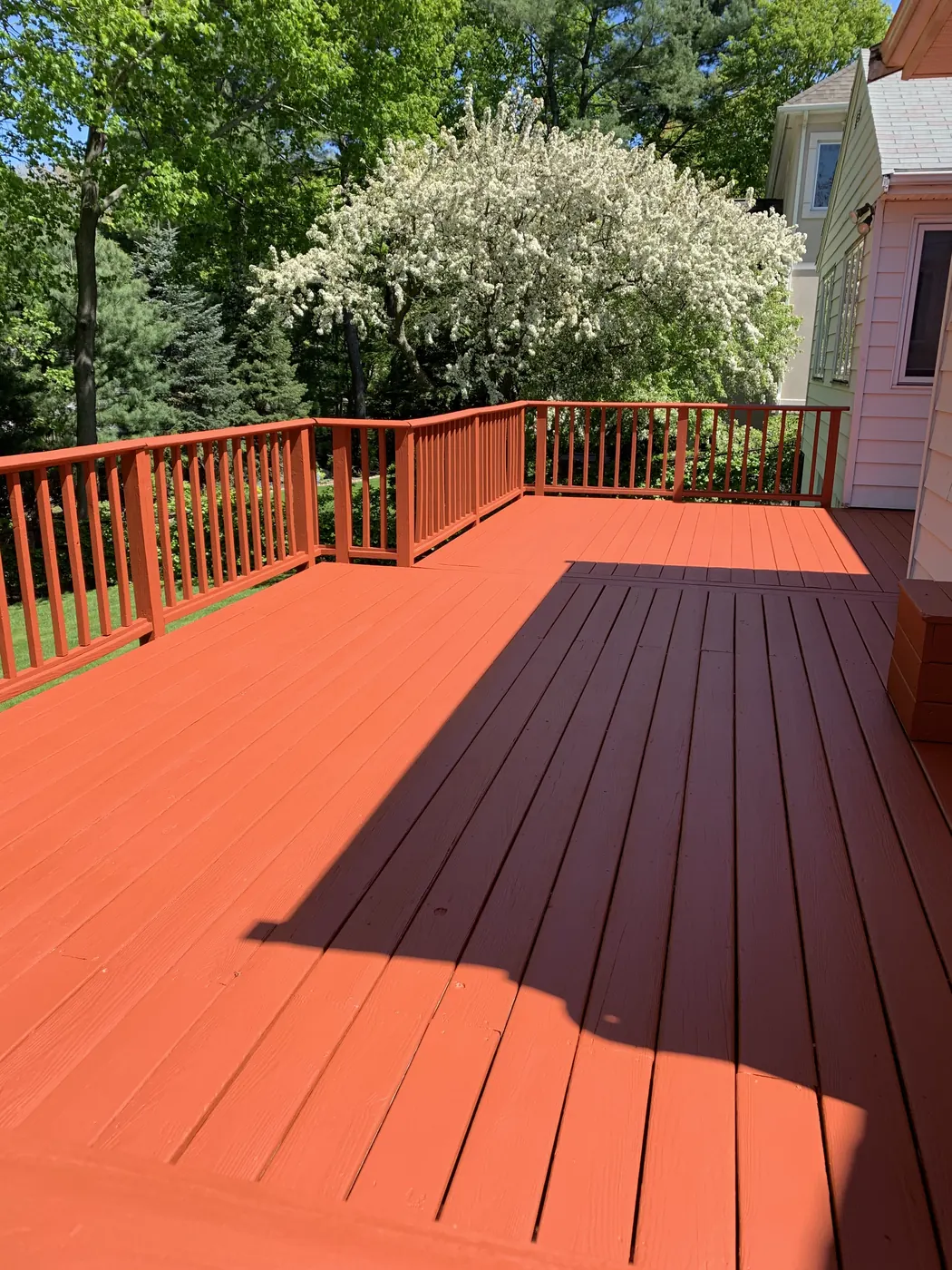 FG Professional Services project: deck and railings finished in a solid red color